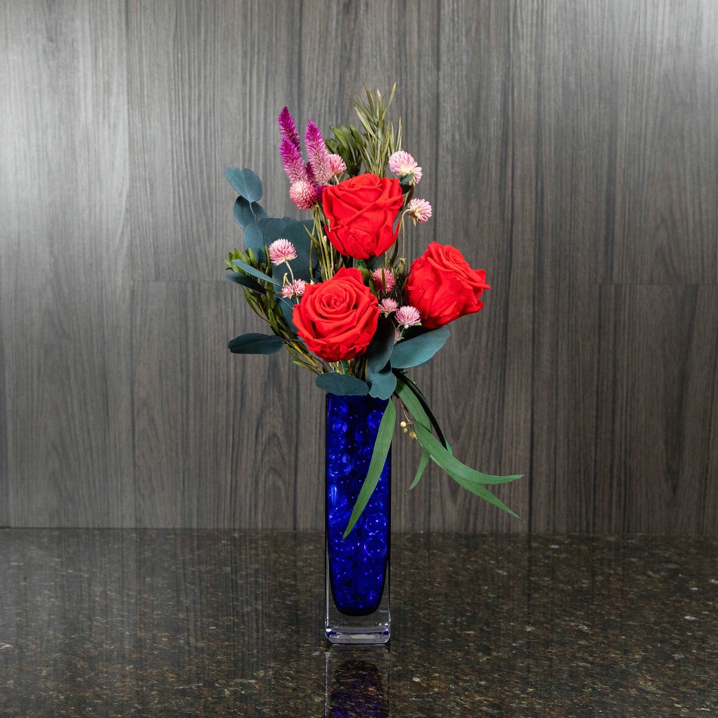 3 Preserved Red Roses in Blue Glass Vase