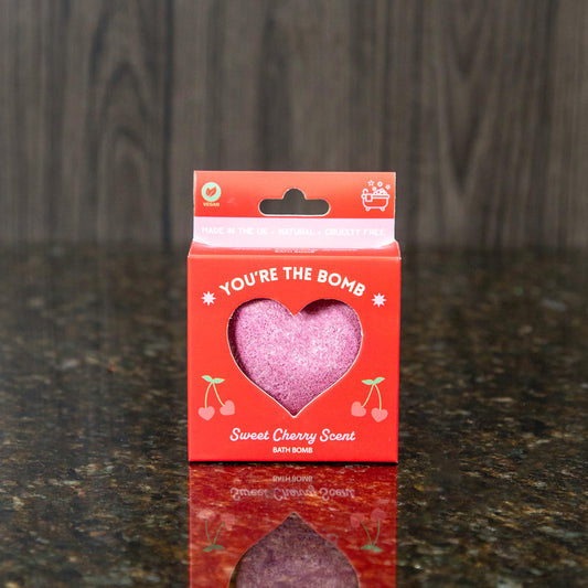 a heart shaped bath bomb in a red box